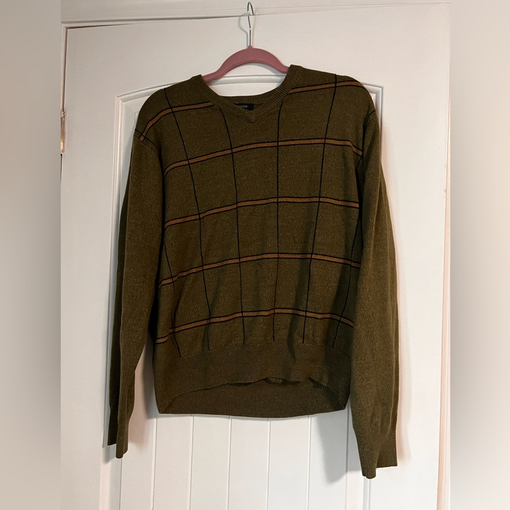 Green sweater with brown strips.